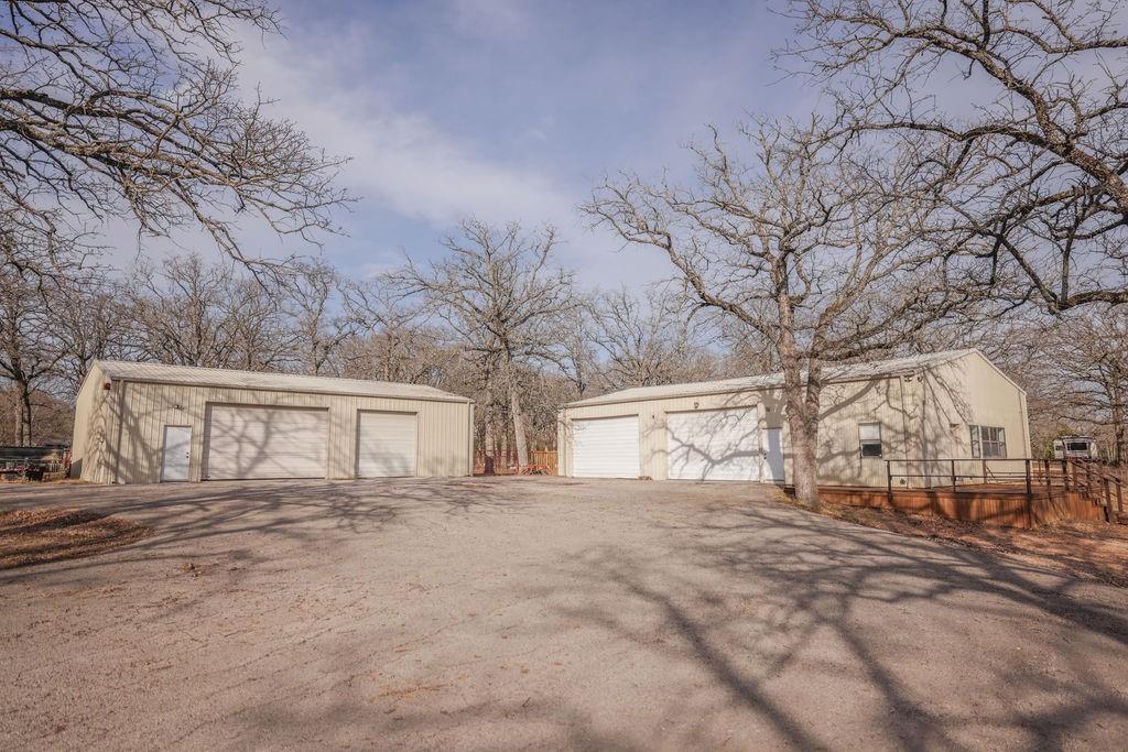 9501 Oakwood Road Quinlan, TX 75474 - Photo 19 of 34 a view of backyard with a white house