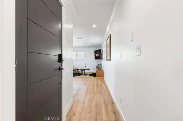 a view of a living room with a wooden floor