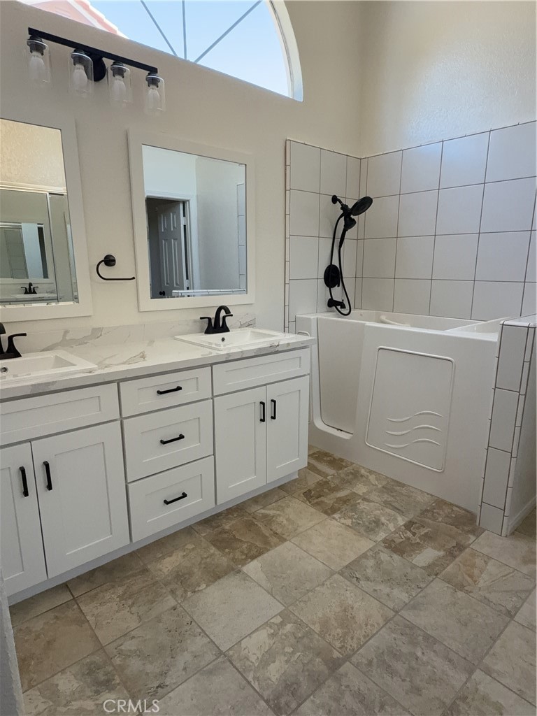 12590 Cobalt Road Victorville, CA 92392 - Photo 30 of 37 a bathroom with a sink and mirror