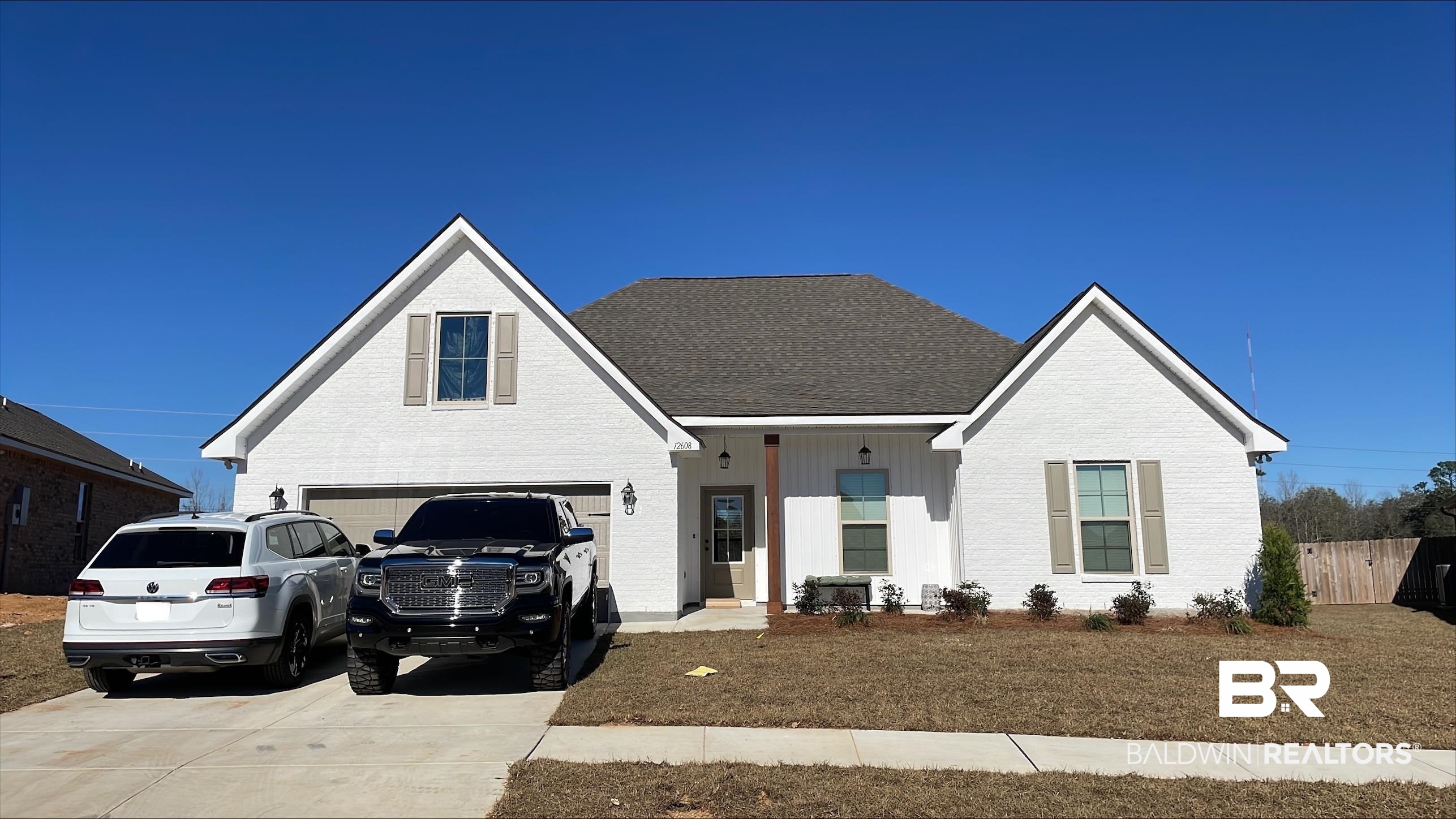 12608 Wagner Avenue Daphne, AL 36527 - Photo 1 of 3 View of front of property with a porch, brick siding, and concrete driveway