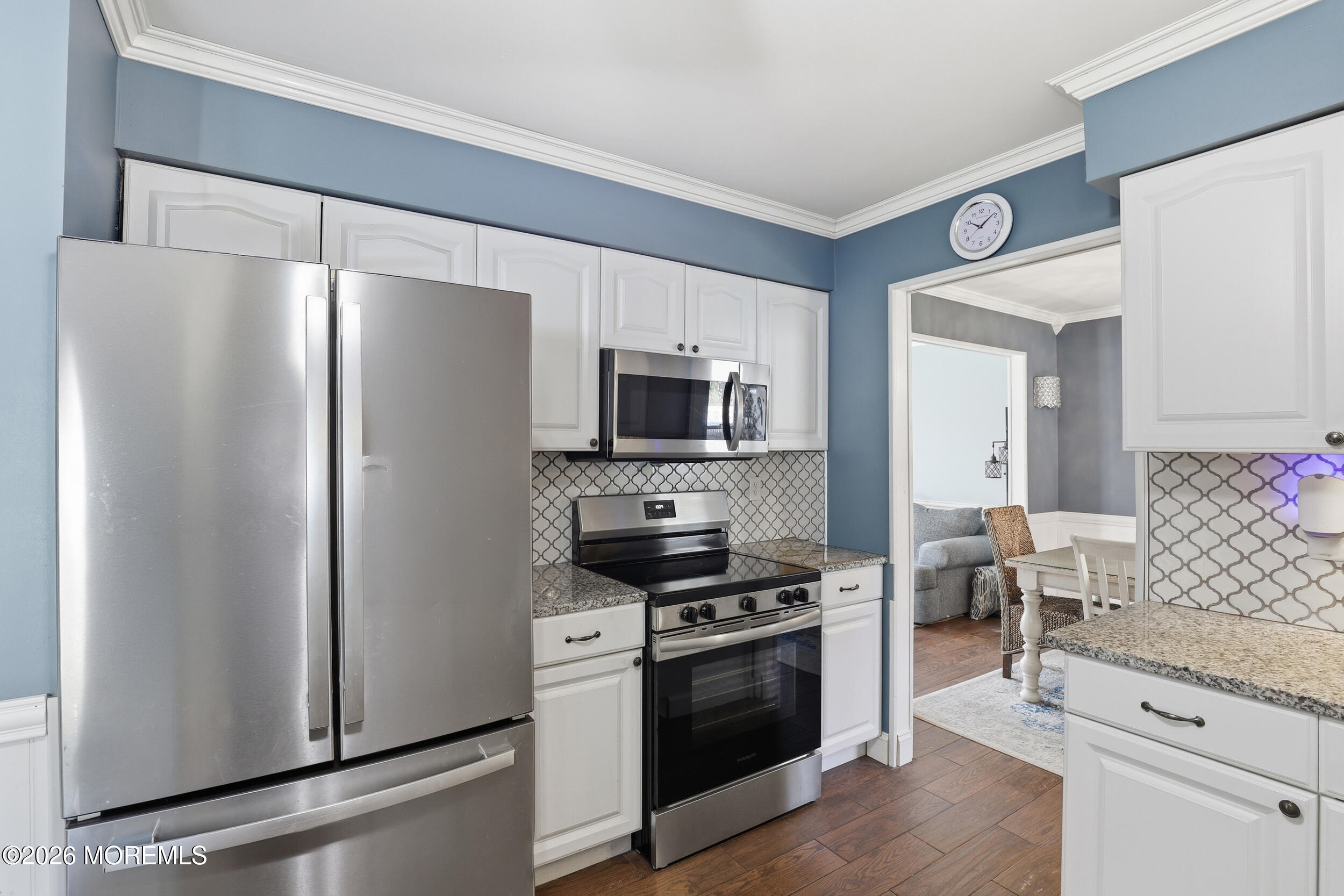 306 Ashford Road Toms River, NJ 08755 - Photo 12 of 33 a kitchen with stainless steel appliances a refrigerator a stove and a sink
