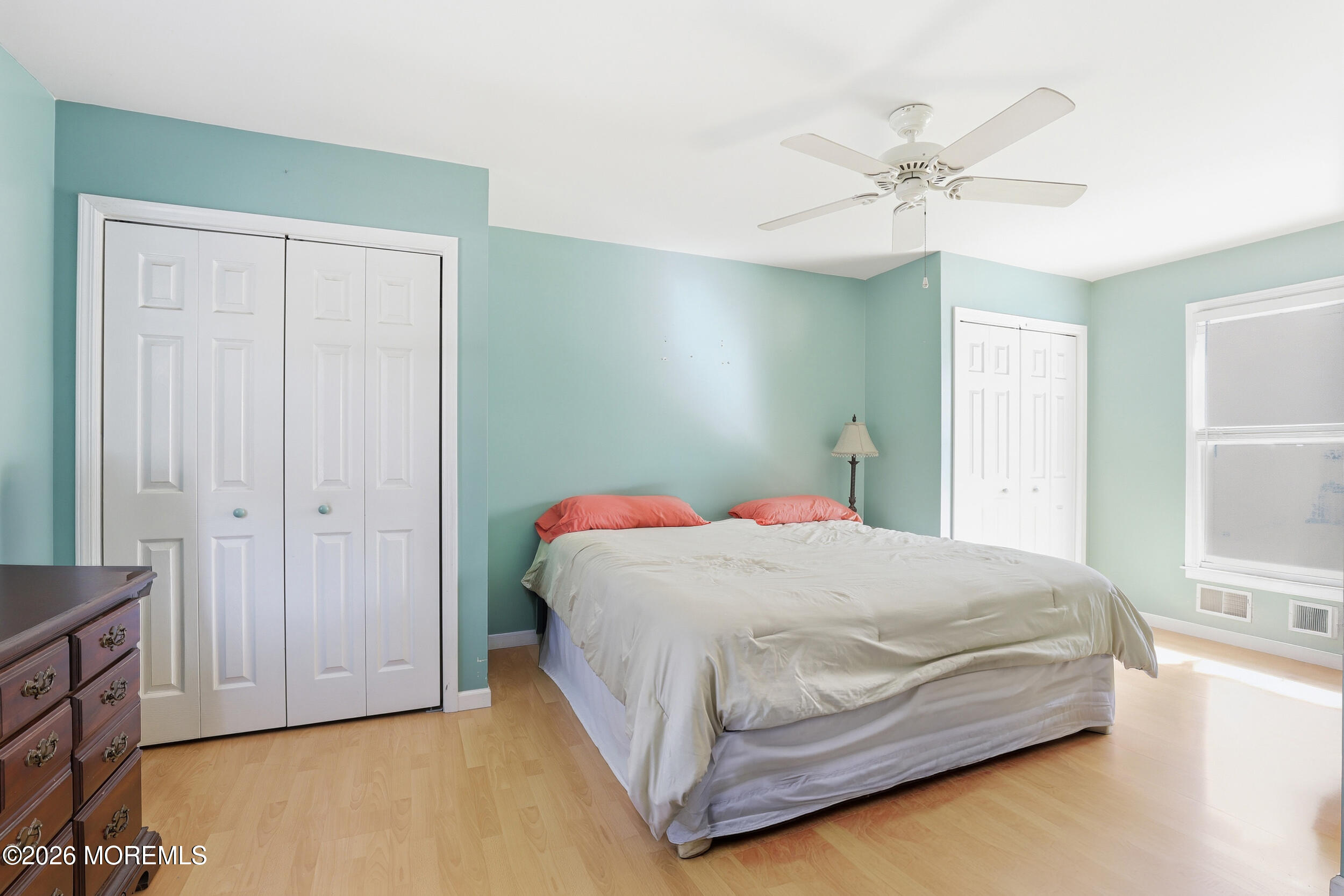 306 Ashford Road Toms River, NJ 08755 - Photo 21 of 33 a bedroom with a bed and a chandelier