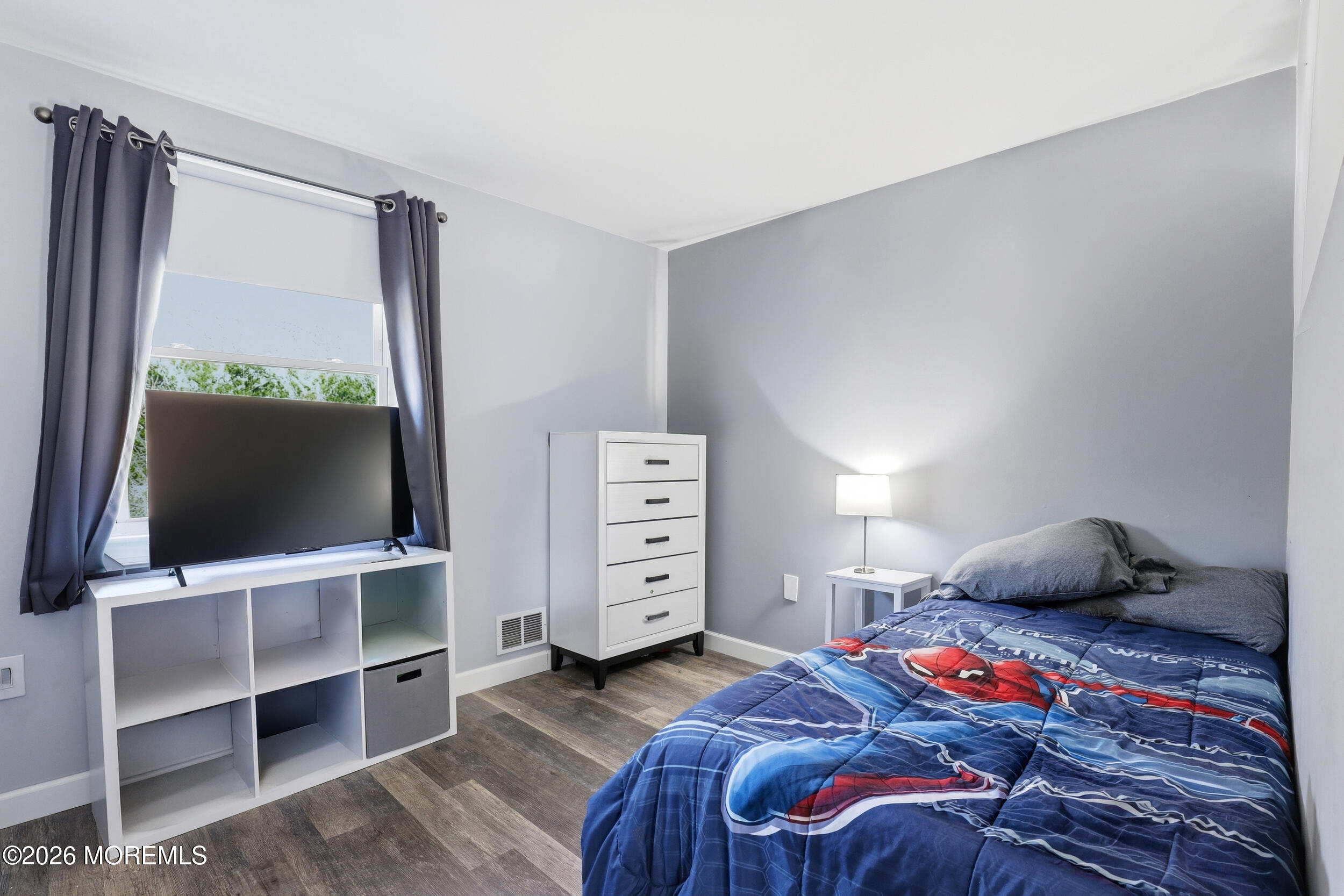 306 Ashford Road Toms River, NJ 08755 - Photo 22 of 33 a bedroom with a bed and a flat tv screen