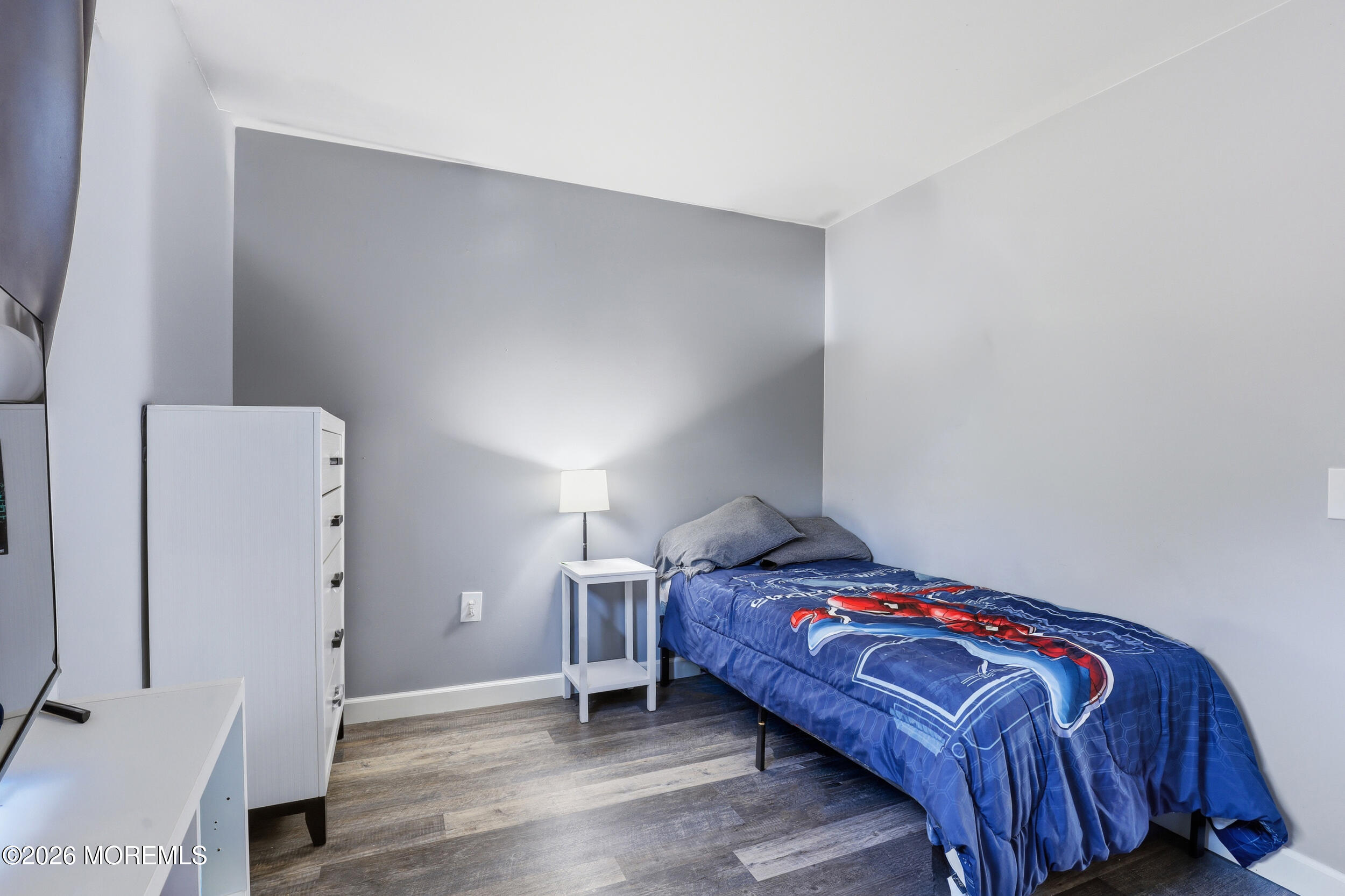 306 Ashford Road Toms River, NJ 08755 - Photo 23 of 33 a bedroom with a bed and a refrigerator