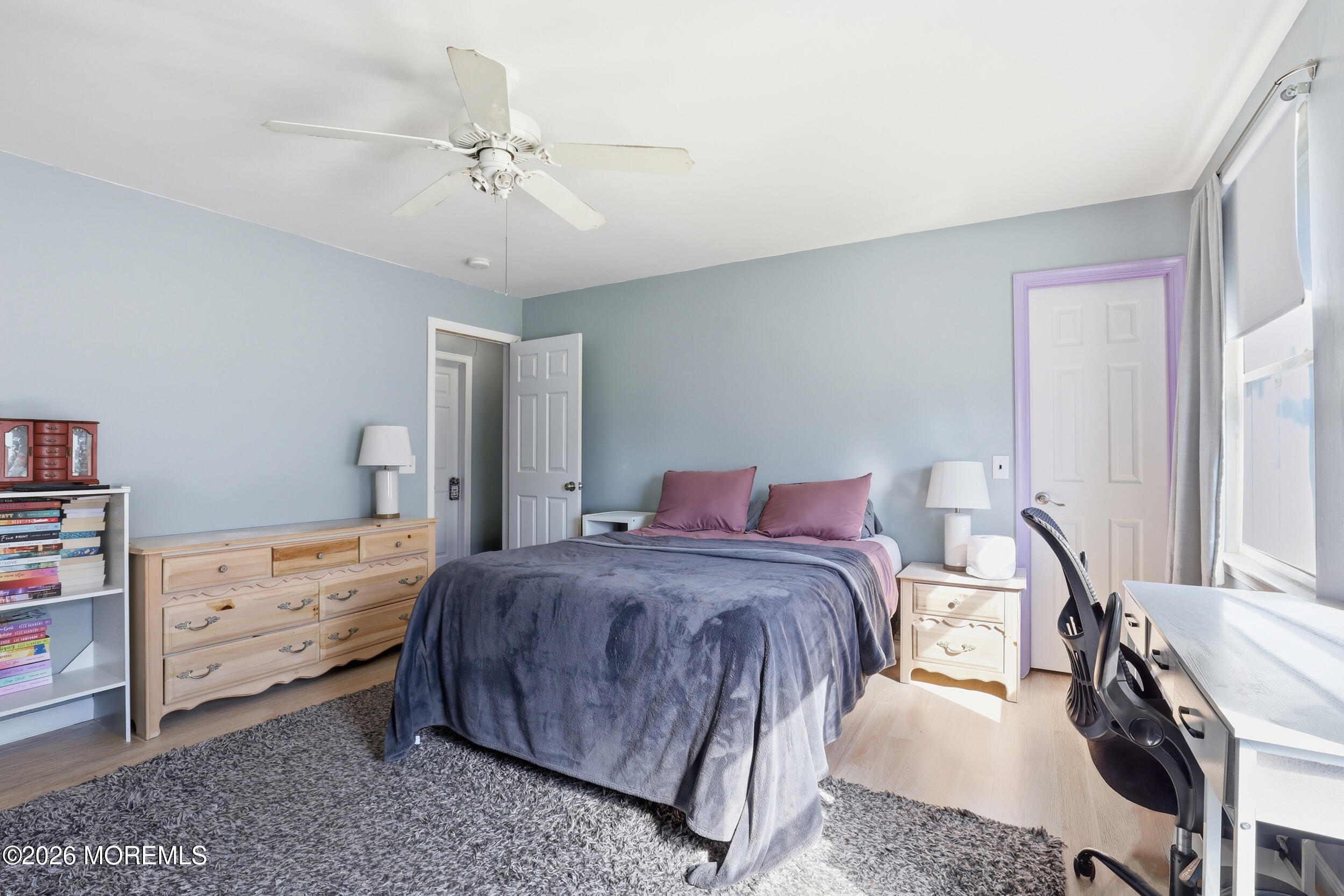 306 Ashford Road Toms River, NJ 08755 - Photo 24 of 33 a bedroom with a bed and a chandelier