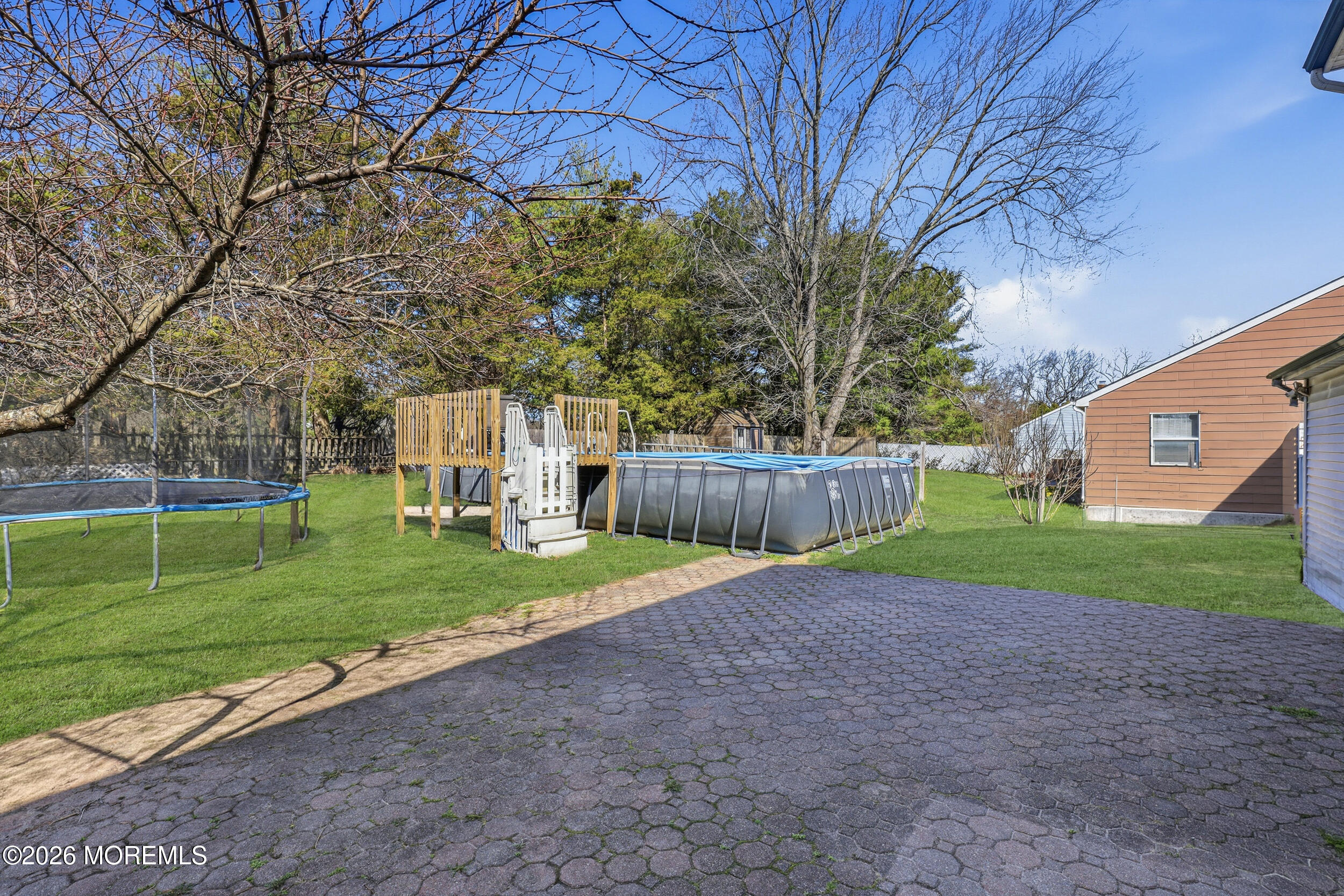 306 Ashford Road Toms River, NJ 08755 - Photo 29 of 33 a view of a backyard with a garden