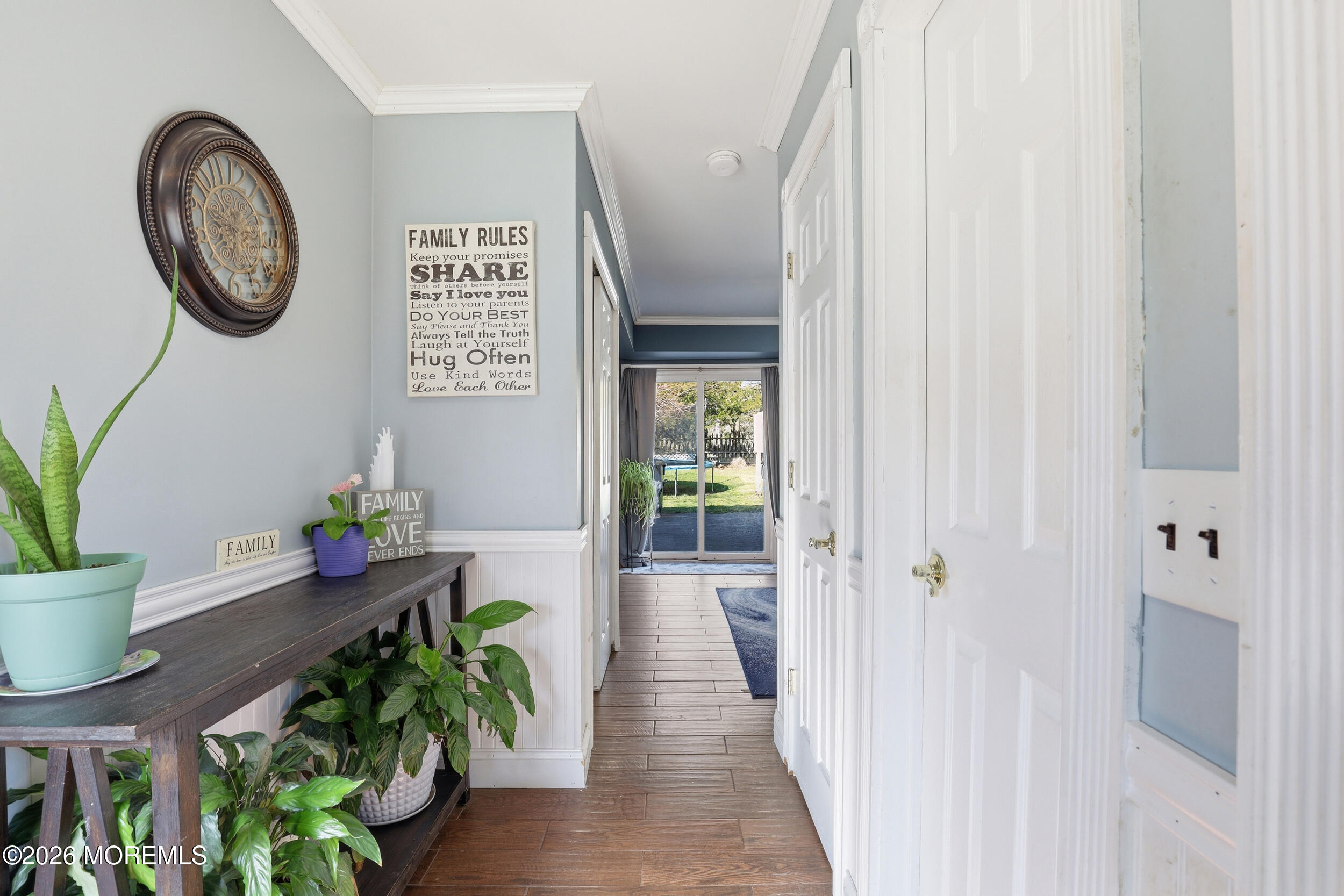 306 Ashford Road Toms River, NJ 08755 - Photo 5 of 33 a hallway with painting on the wall