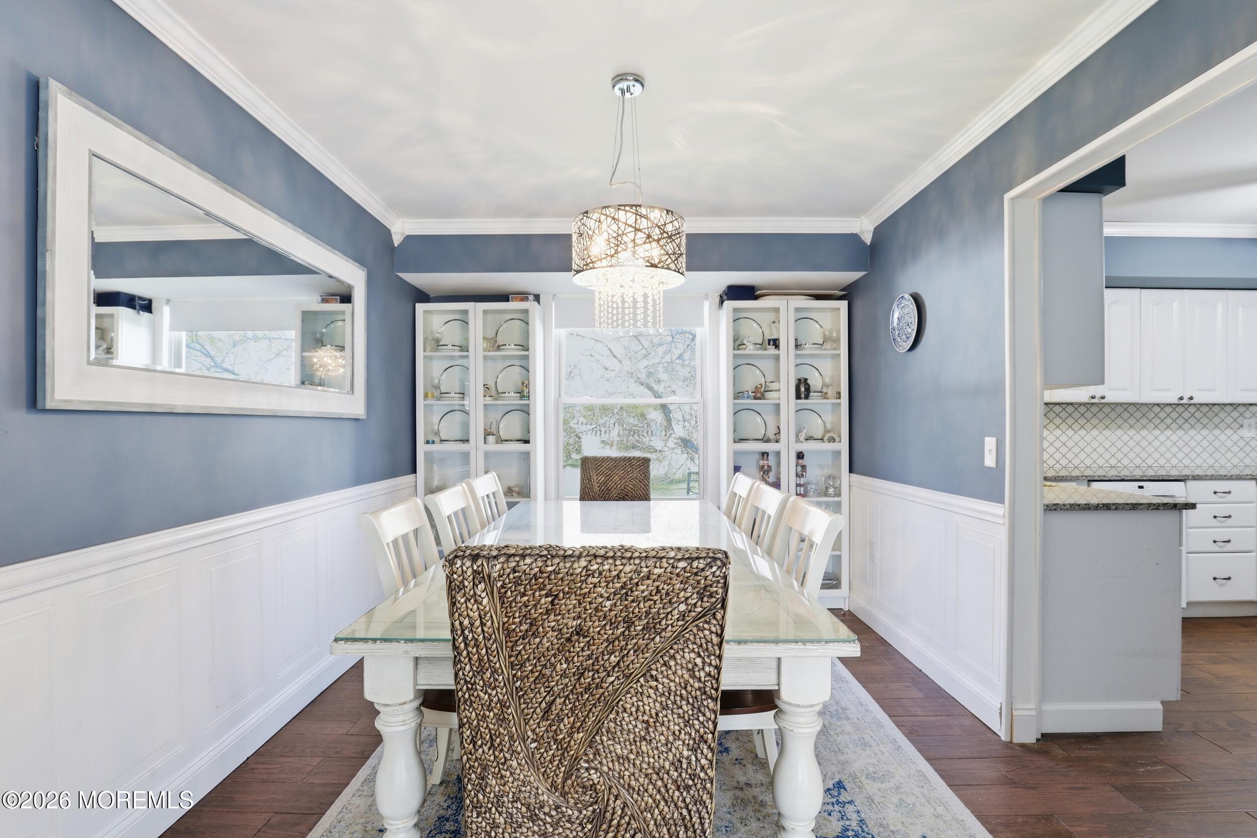 306 Ashford Road Toms River, NJ 08755 - Photo 9 of 33 a living room with furniture and a chandelier