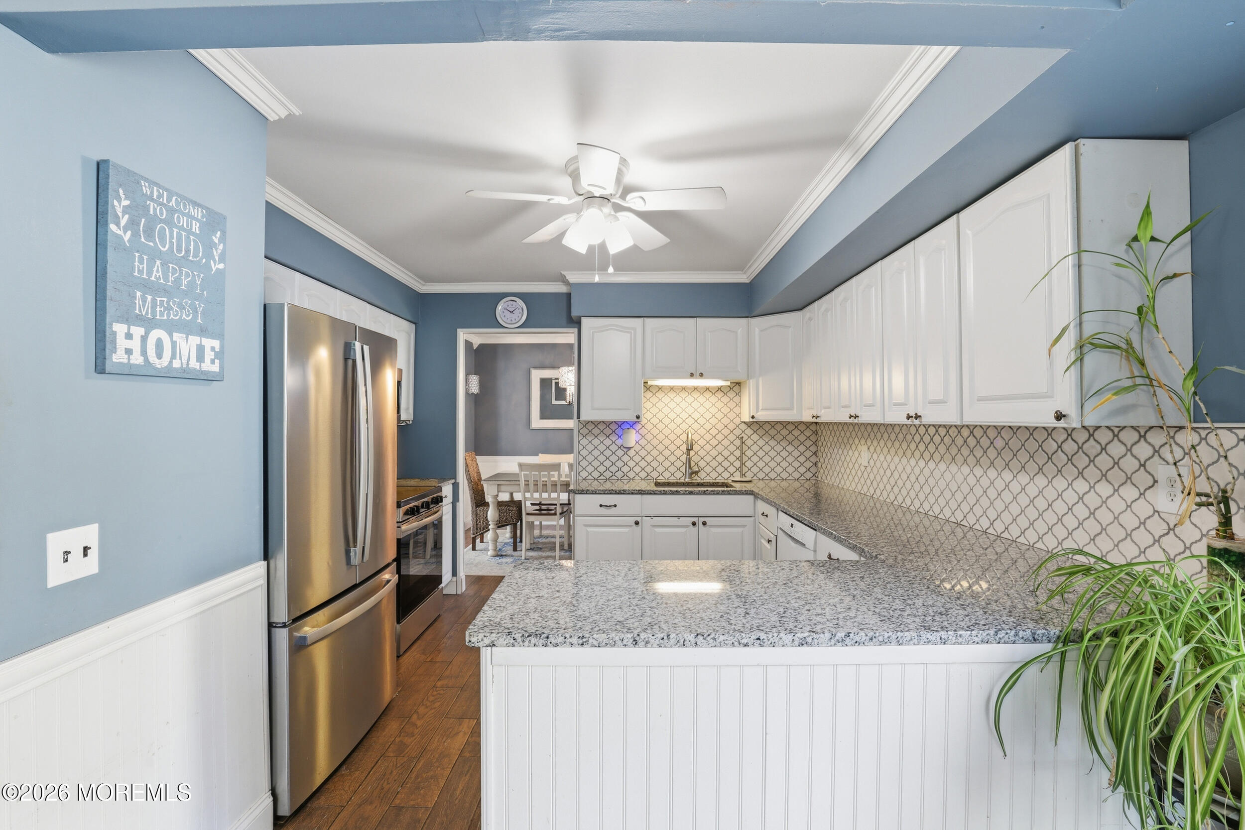 306 Ashford Road Toms River, NJ 08755 - Photo 10 of 33 a kitchen with stainless steel appliances granite countertop a sink a stove and a refrigerator