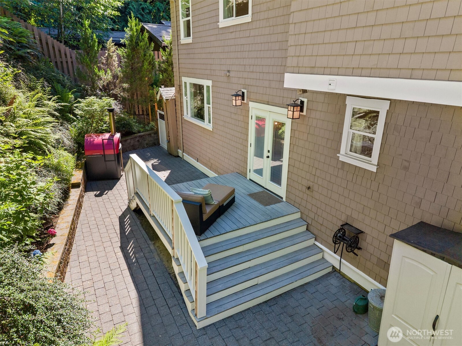 89 Grand View Lane Bellingham, WA 98229 - Photo 33 of 40 a view of a patio with table and chairs with wooden floor and plants
