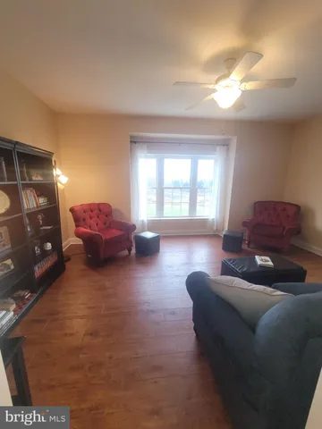 a bedroom with a bed and a chair