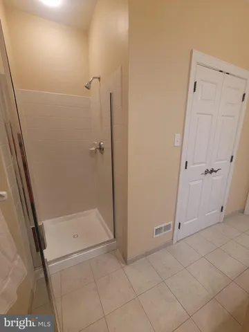 a bathroom with a bathtub and window
