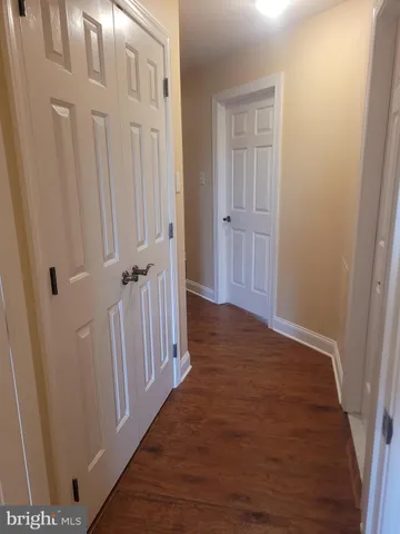 a living room with furniture a rug and a chandelier