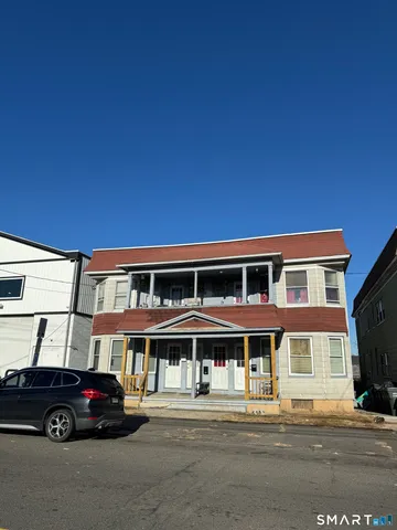 a black car parked in front of a building