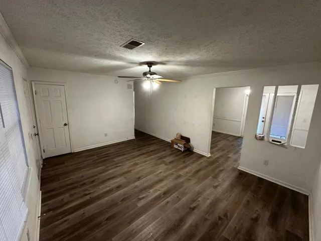 a view of a livingroom with wooden floor
