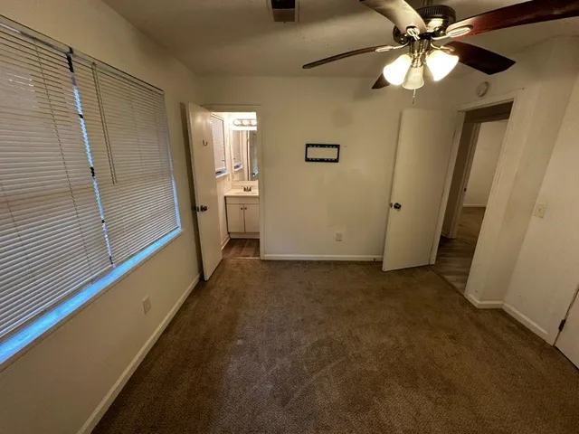 a view of a hallway with a chandelier