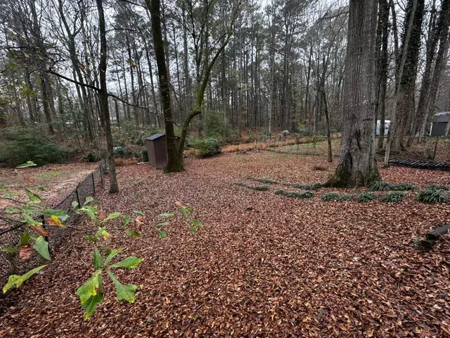 a backyard of a house with lots of green space