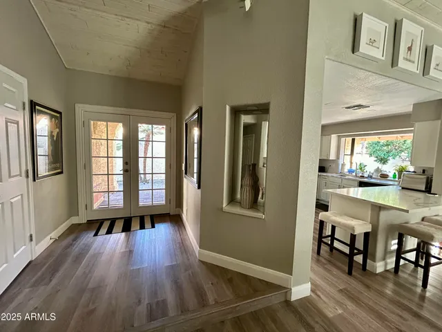a view of livingroom with furniture wooden floor and windows
