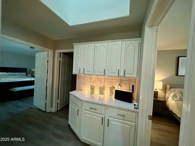 a kitchen with a refrigerator and cabinets