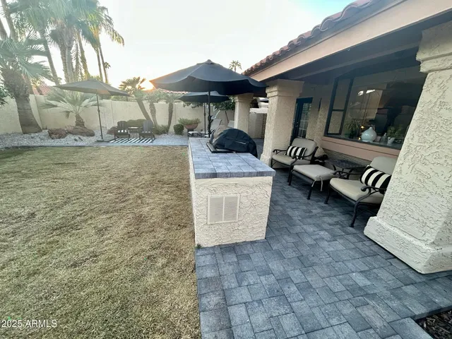 a front view of a house with outdoor seating