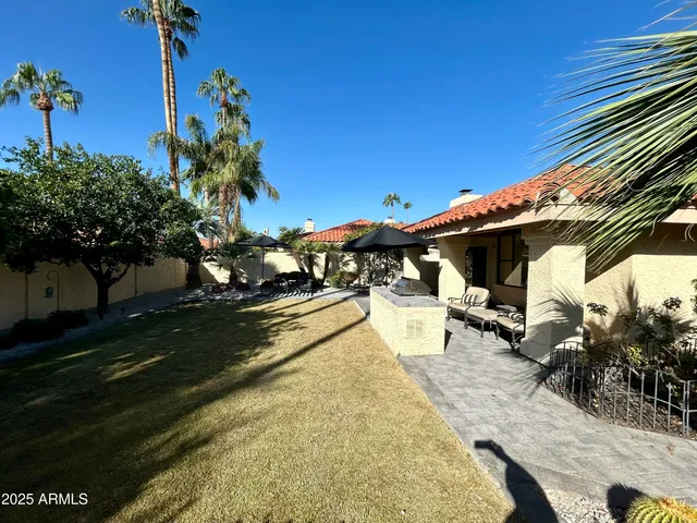 a view of a swimming pool with a patio