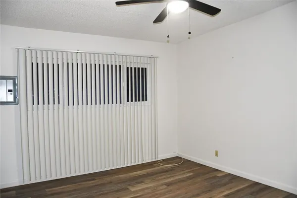 a view of a livingroom with wooden floor