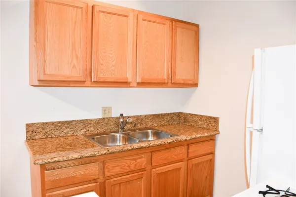 a bathroom with a sink and cabinets