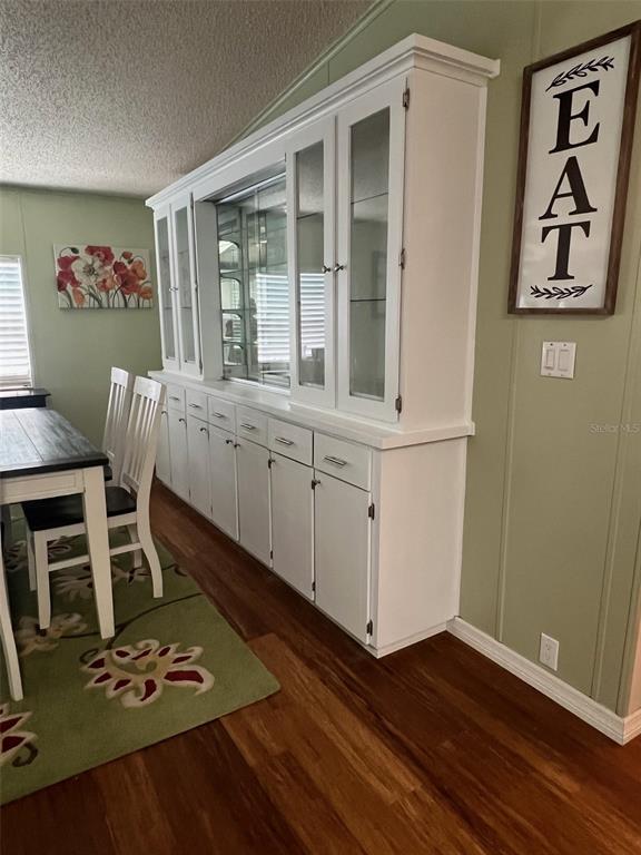 1001 Starkey Road, Unit 177 Largo, FL 33771 - Photo 15 of 44 a view of a workspace with furniture and wooden floor