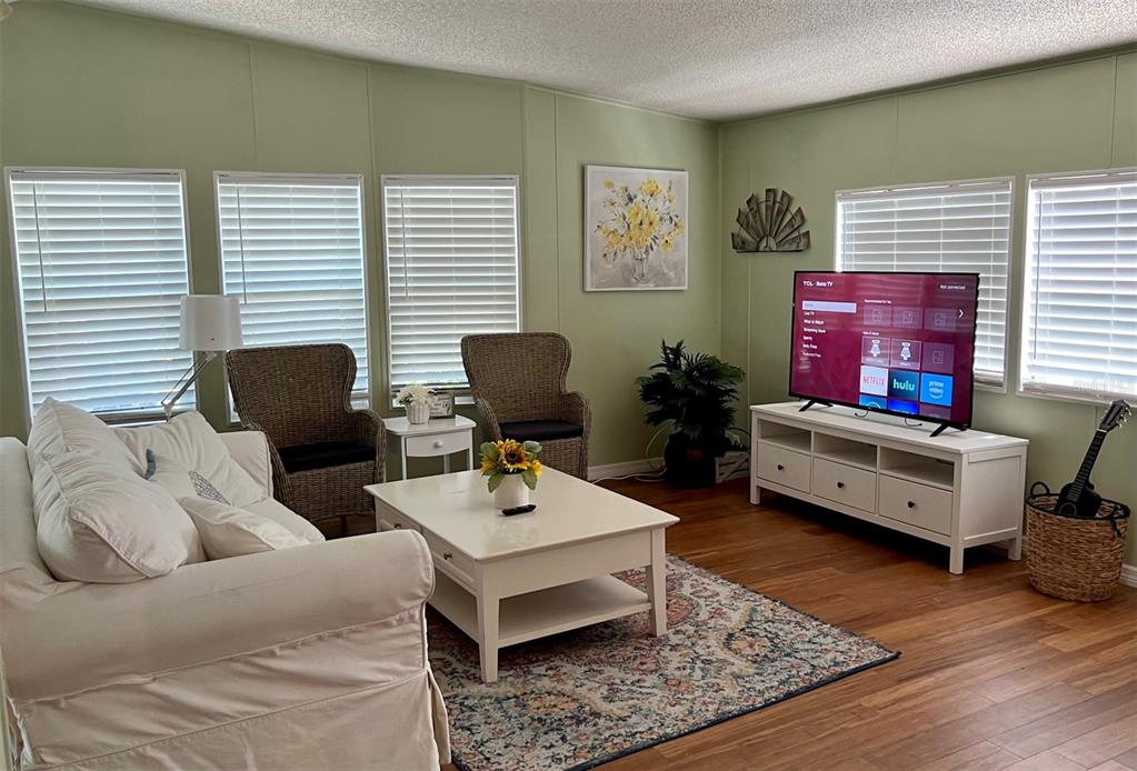 1001 Starkey Road, Unit 177 Largo, FL 33771 - Photo 19 of 44 a living room with furniture and wooden floor