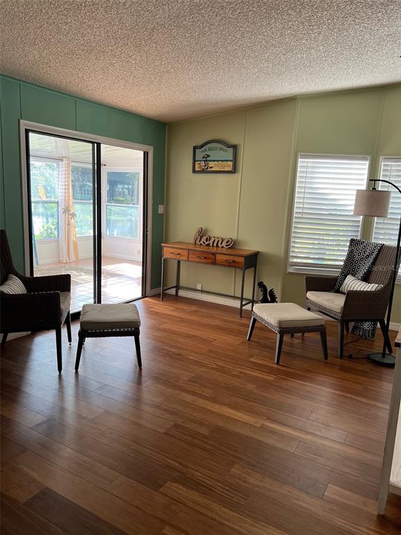 1001 Starkey Road, Unit 177 Largo, FL 33771 - Photo 20 of 44 a living room with furniture and a wooden floor