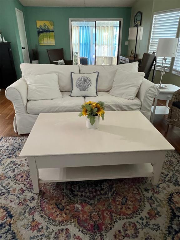 1001 Starkey Road, Unit 177 Largo, FL 33771 - Photo 23 of 44 a living room with furniture and painting on the wall