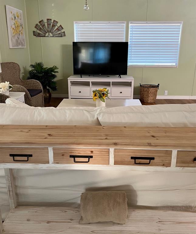 1001 Starkey Road, Unit 177 Largo, FL 33771 - Photo 24 of 44 a living room with furniture and a flat screen tv