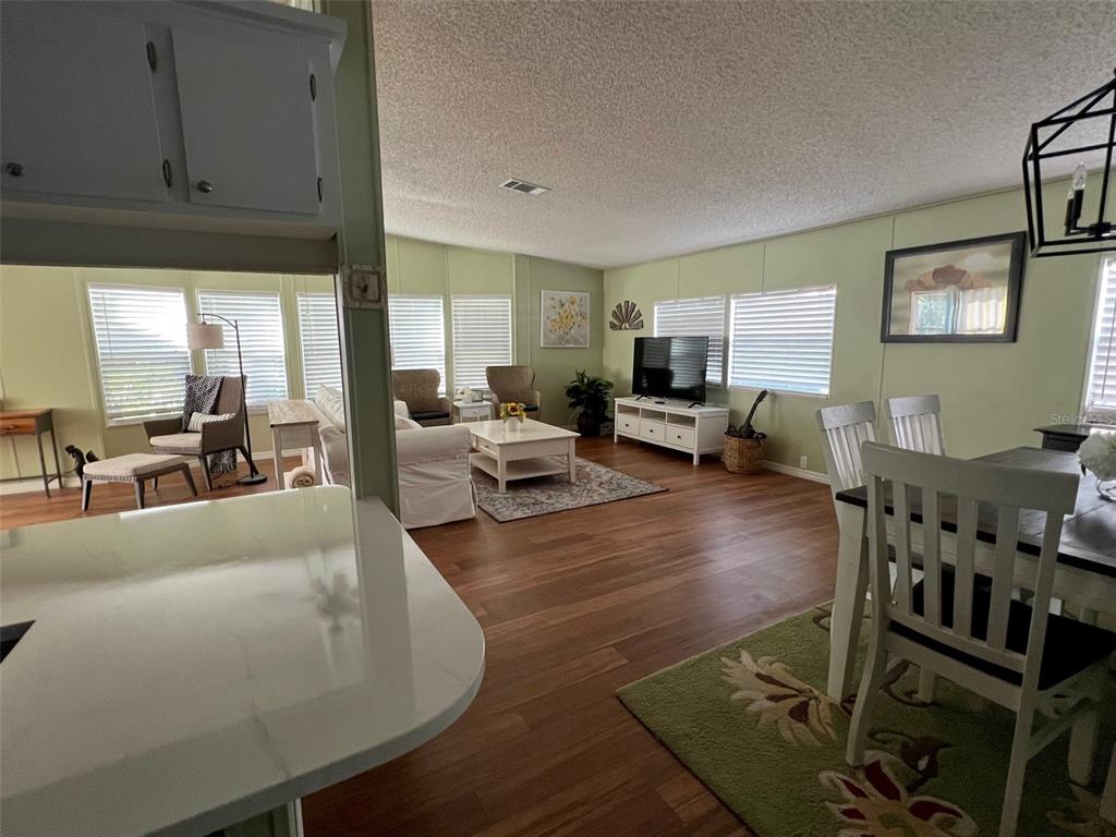 1001 Starkey Road, Unit 177 Largo, FL 33771 - Photo 25 of 44 a living room with furniture and a flat screen tv