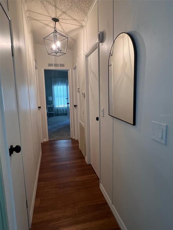 1001 Starkey Road, Unit 177 Largo, FL 33771 - Photo 28 of 44 a view of a hallway with wooden floor and staircase