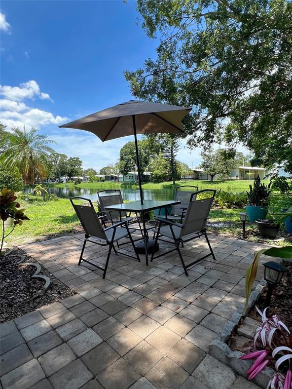 1001 Starkey Road, Unit 177 Largo, FL 33771 - Photo 3 of 44 a view of a backyard with furniture and a garden