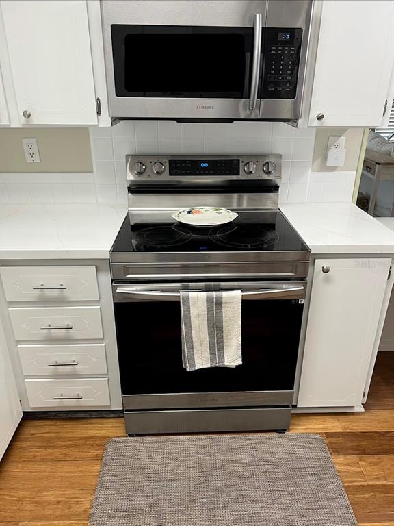 1001 Starkey Road, Unit 177 Largo, FL 33771 - Photo 10 of 44 a stove top oven sitting inside of a kitchen