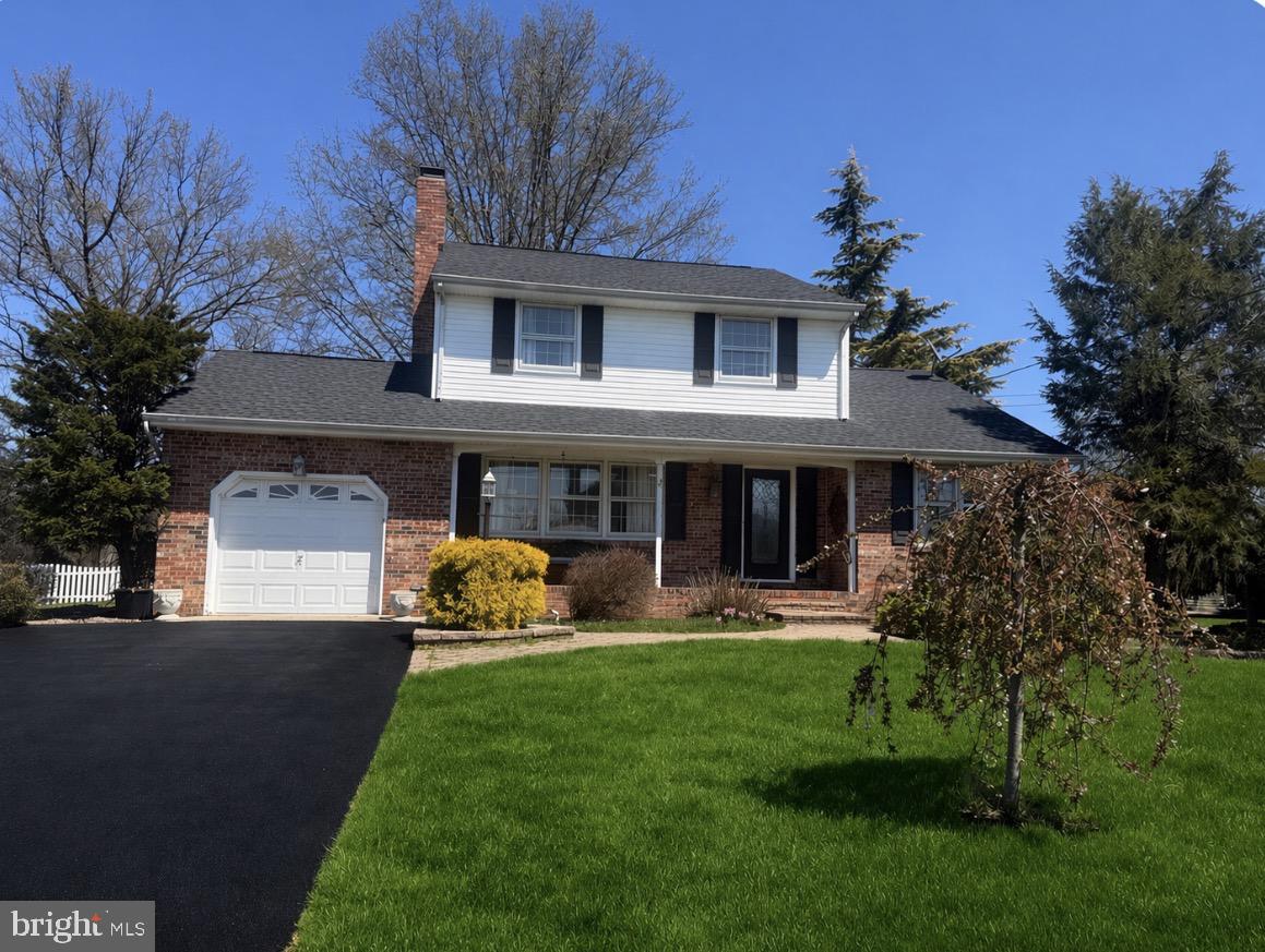 25618 Mt Pleasant Road Columbus, NJ 08022 - Photo 2 of 61 a front view of a house with a garden and plants
