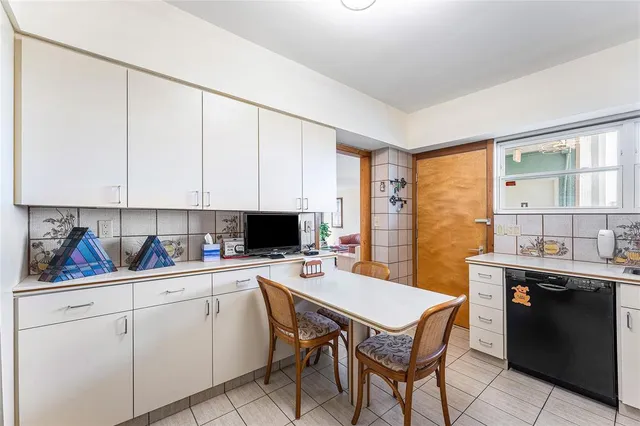 a bedroom with a bed and cabinets
