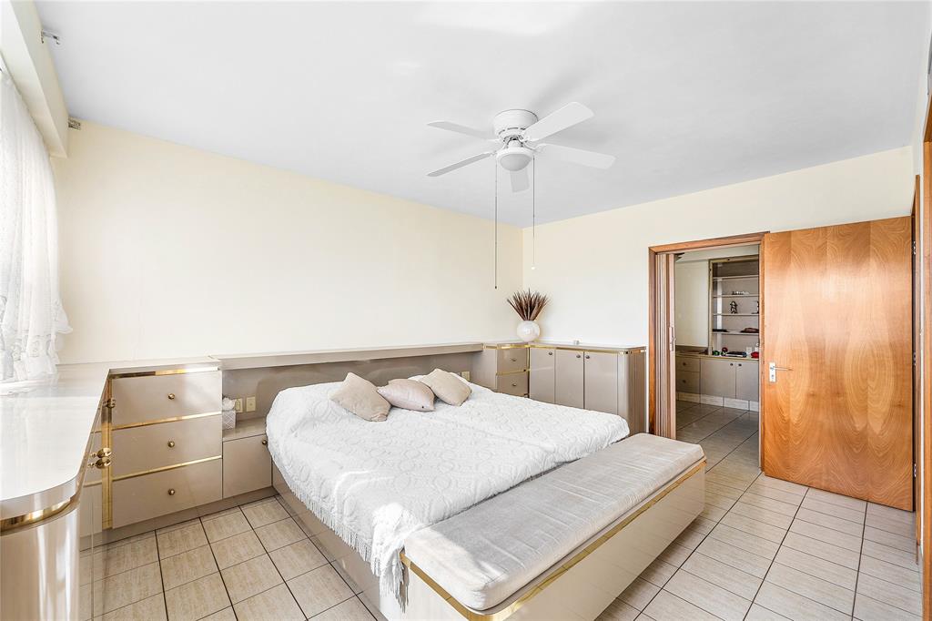 1900 South Ocean Drive, Unit 812 Fort Lauderdale, FL 33316 - Photo 27 of 65 a bedroom with a bed and a walk in closet