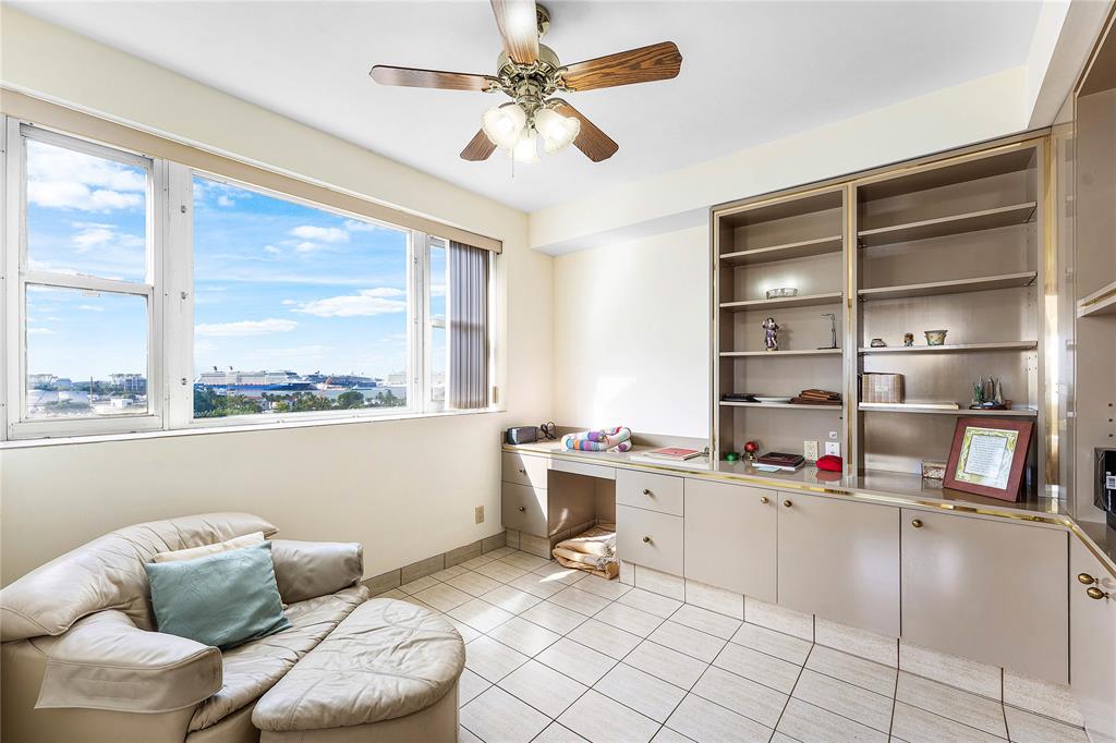 1900 South Ocean Drive, Unit 812 Fort Lauderdale, FL 33316 - Photo 30 of 65 a living room with furniture a flat screen tv and a large window