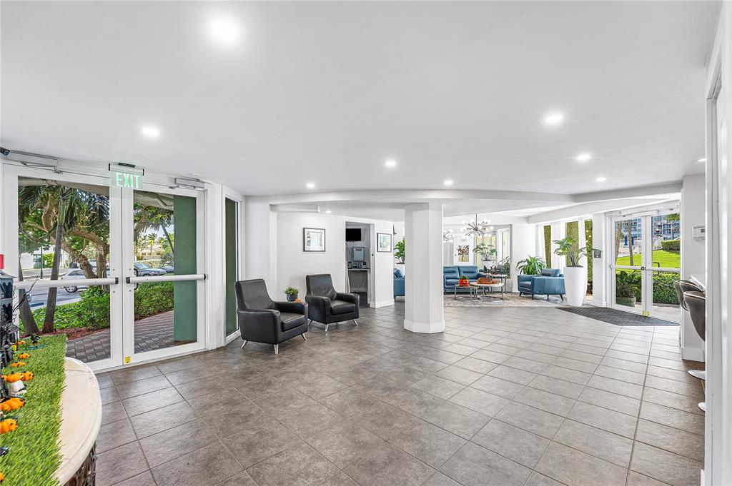 1900 South Ocean Drive, Unit 812 Fort Lauderdale, FL 33316 - Photo 48 of 65 a living room with furniture large window and flat screen tv