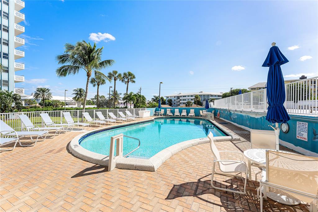 1900 South Ocean Drive, Unit 812 Fort Lauderdale, FL 33316 - Photo 51 of 65 a view of swimming pool with outdoor seating and plants