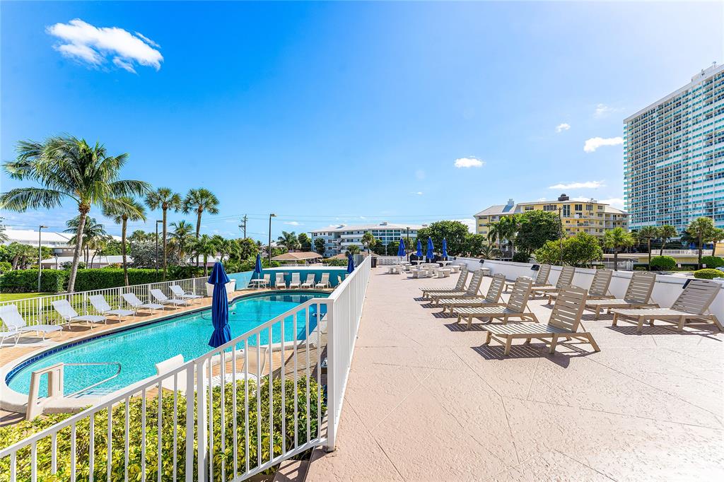 1900 South Ocean Drive, Unit 812 Fort Lauderdale, FL 33316 - Photo 54 of 65 a view of a chairs and table in patio with a lake view
