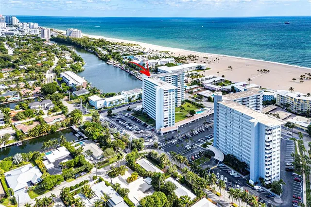 a kitchen with a refrigerator and a stove top oven