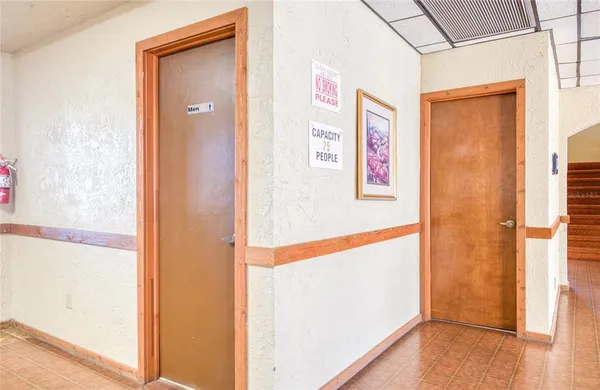 a balcony with table and chairs