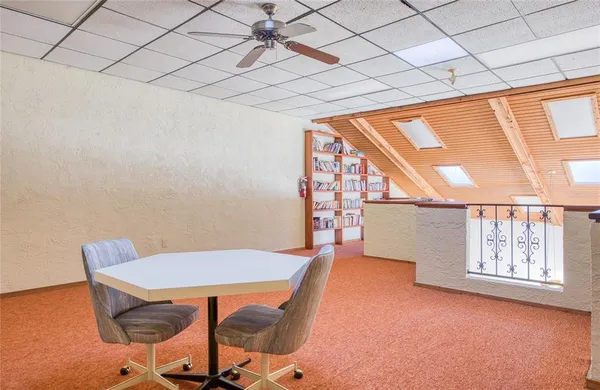 a view of a house with a backyard patio and swimming pool