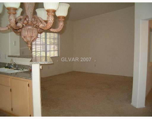 1881 West Alexander Road, Unit 1039 North Las Vegas, NV 89032 - Photo 4 of 8 Living Room.