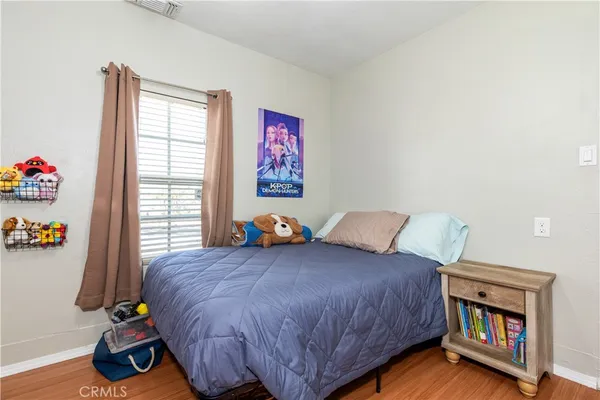 a bed room with a bed and a couch