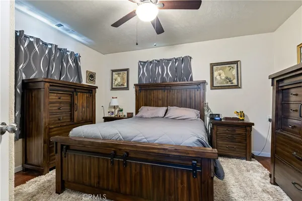 a bedroom with a bed and dresser