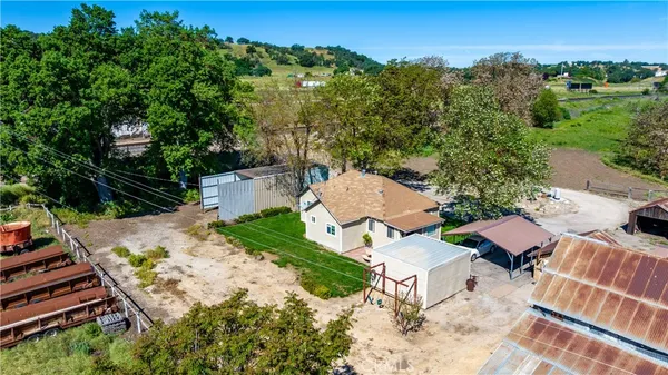 an aerial view of a house with outdoor space
